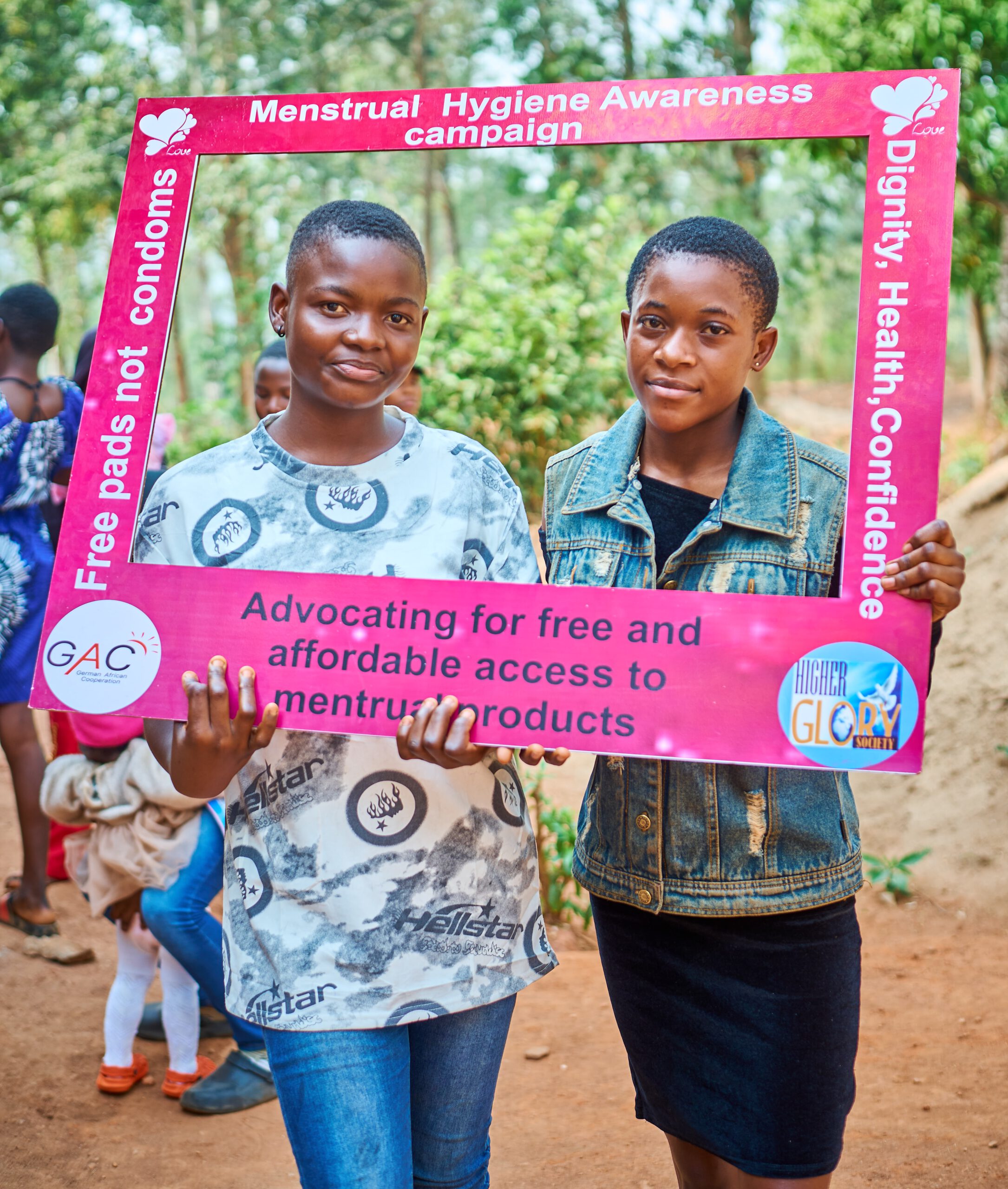Girls holding the MHAC campaign banner
